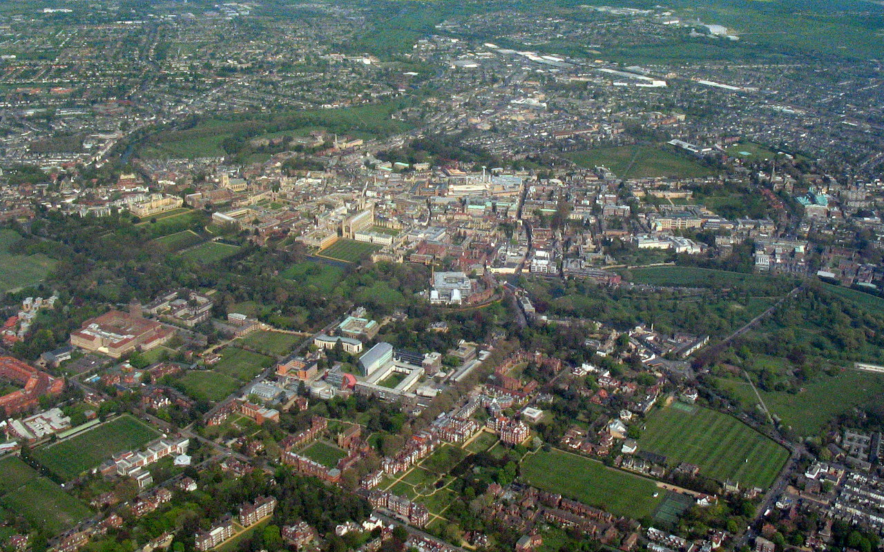 Aerial view of Cambridge from the west, showing the city’s buildings and green spaces.